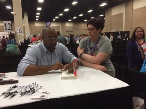 Kwame Alexander signs his book SOLO at TLA 2017