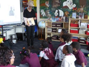 Carole Boston Weatherford reads to school children.